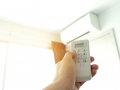 Controlled air conditioning Turn off air conditioning remote. Energy saving concept.