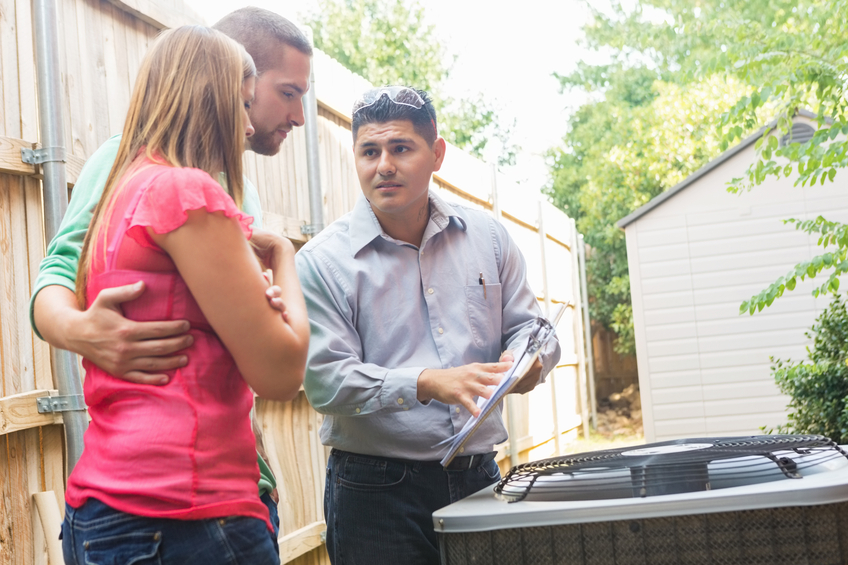 Air Conditioner repairman with couple