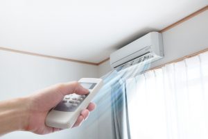 Air conditioner blowing cold air through vent
